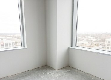 Finished drywall corner with new window returns